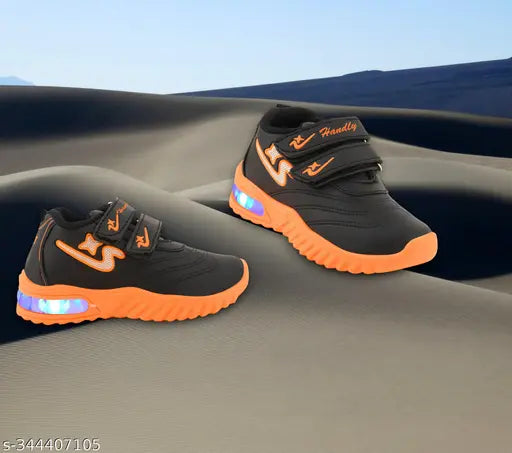 Orange and black LED casual sports shoes for kids, featuring Velcro closures