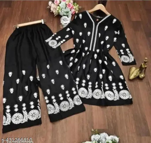 Black rayon top and bottom set with three-quarter sleeves, featuring intricate embroidery work. Indian handcrafted women's and girls' dress set with shrug accessory