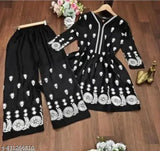 Black rayon top and bottom set with three-quarter sleeves, featuring intricate embroidery work. Indian handcrafted women's and girls' dress set with shrug accessory