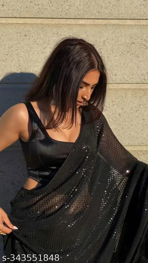 Black sequined sari with fishnet design, shimmering fabric