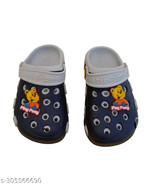 Blue clog shoes with round footbeds and teddy bear charm