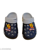 Blue clog shoes with round footbeds and teddy bear charm