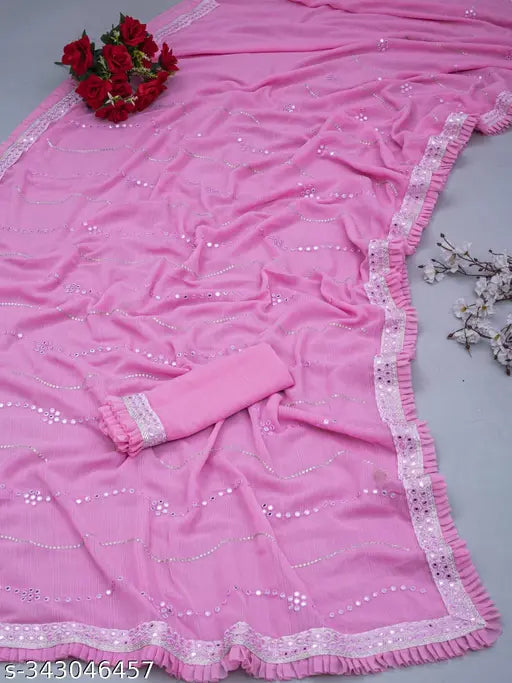 Pink and white floral embroidered saree with tassels, laid out flat