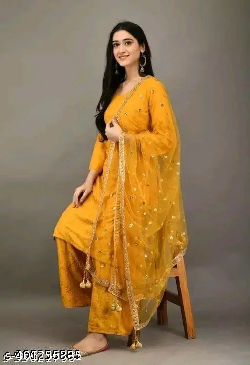 A yellow women's dupatta and kurta set with intricate Kajukatri embroidery, long sleeves