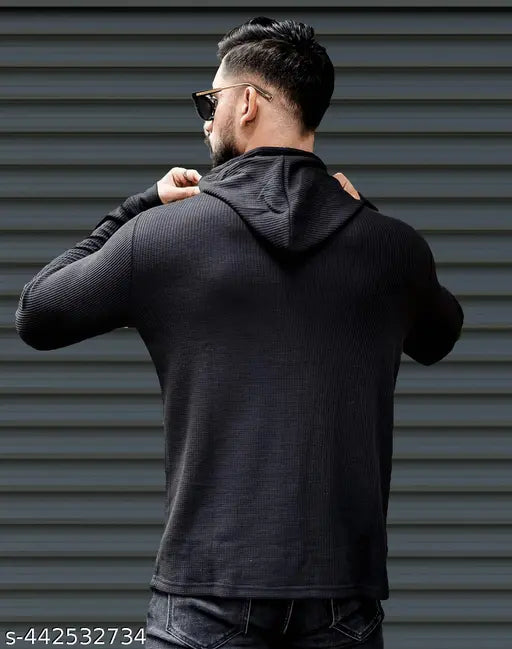 Black polyester long sleeve hoodie, solid design for men on display rack