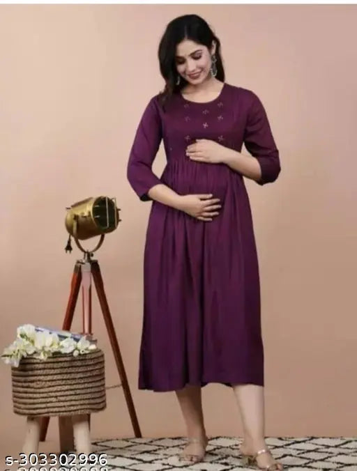 A purple, short-sleeve maternity dress with a front zipper
