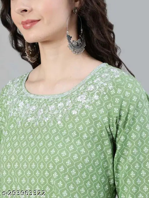 A person wearing a light blue patterned long-sleeved top