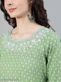 A person wearing a light blue patterned long-sleeved top