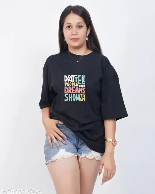 Black oversized t-shirt with white text, printed on a female model