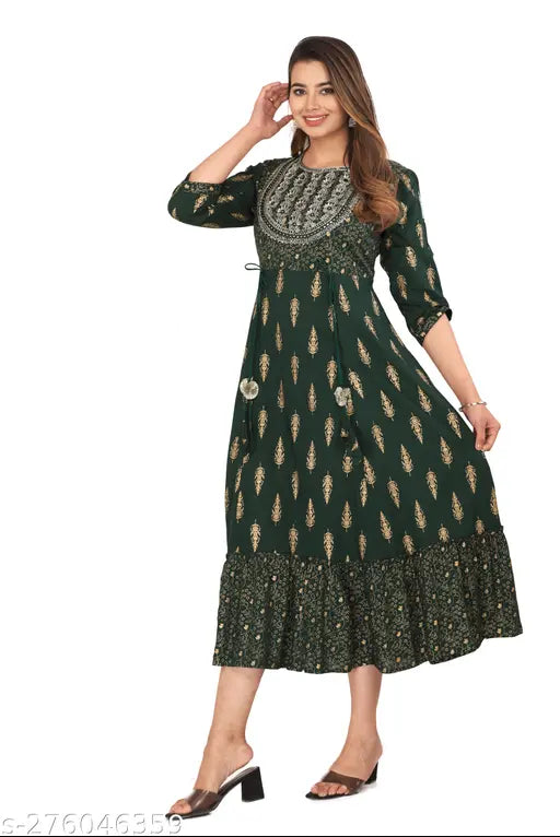 A long kameez in a dark green color with intricate embroidery, full-length sleeves, and a flared bottom