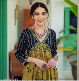 Yellow rayon kurti gown with botanical print, three-quarter sleeves. Vibrant and stylish party wear