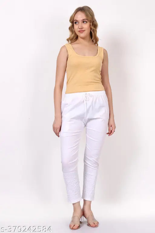 White cotton lycra pant with floral computer embroidery, elastic waistband and drawstrings, perfect for women's casual wear, India origin