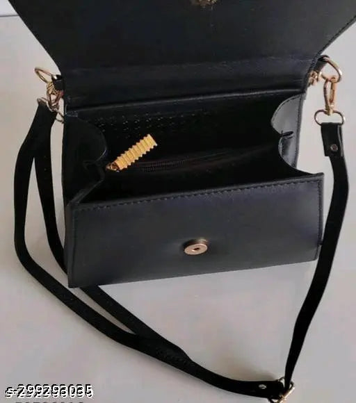 A navy blue sling handbag with a gold lock
