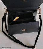 A navy blue sling handbag with a gold lock
