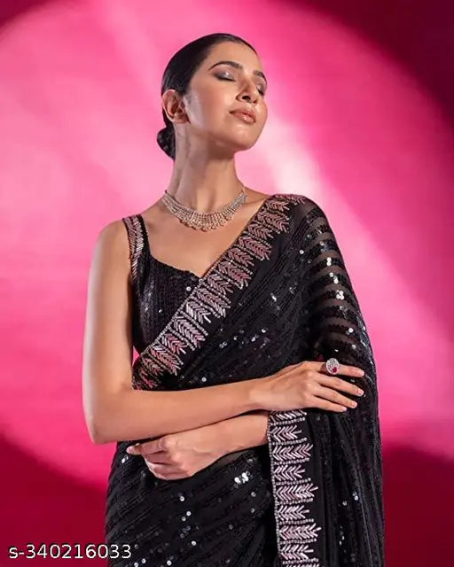 Black geo-patterned sari with silver sequin borders and intricate patterns