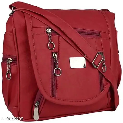 Red shoulder bag with multiple compartments, slender metal hardware