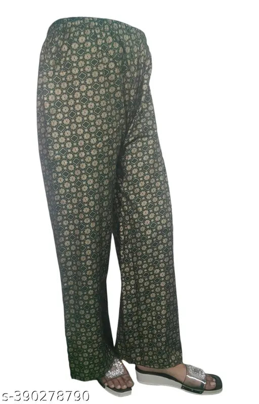 Printed flowery pants with a hemline that is slightly different on each side, resembling a riyon style