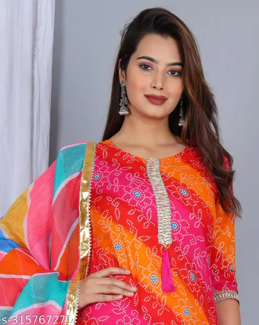A vibrant printed kurta skirt with a matching dupatta set