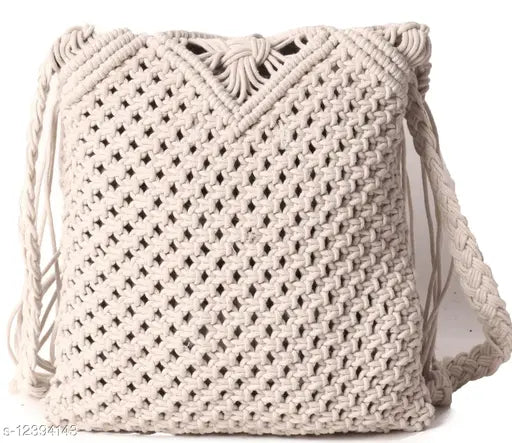 Trendy white slingbag with rope handle and tassel detail
