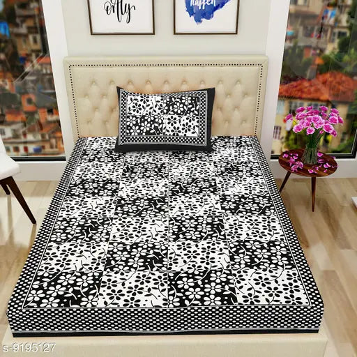 Black & white floral Jaipuri 2-piece bedsheet set, 104 TC cotton, with 2 pillow covers.
