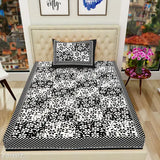 Black & white floral Jaipuri 2-piece bedsheet set, 104 TC cotton, with 2 pillow covers.
