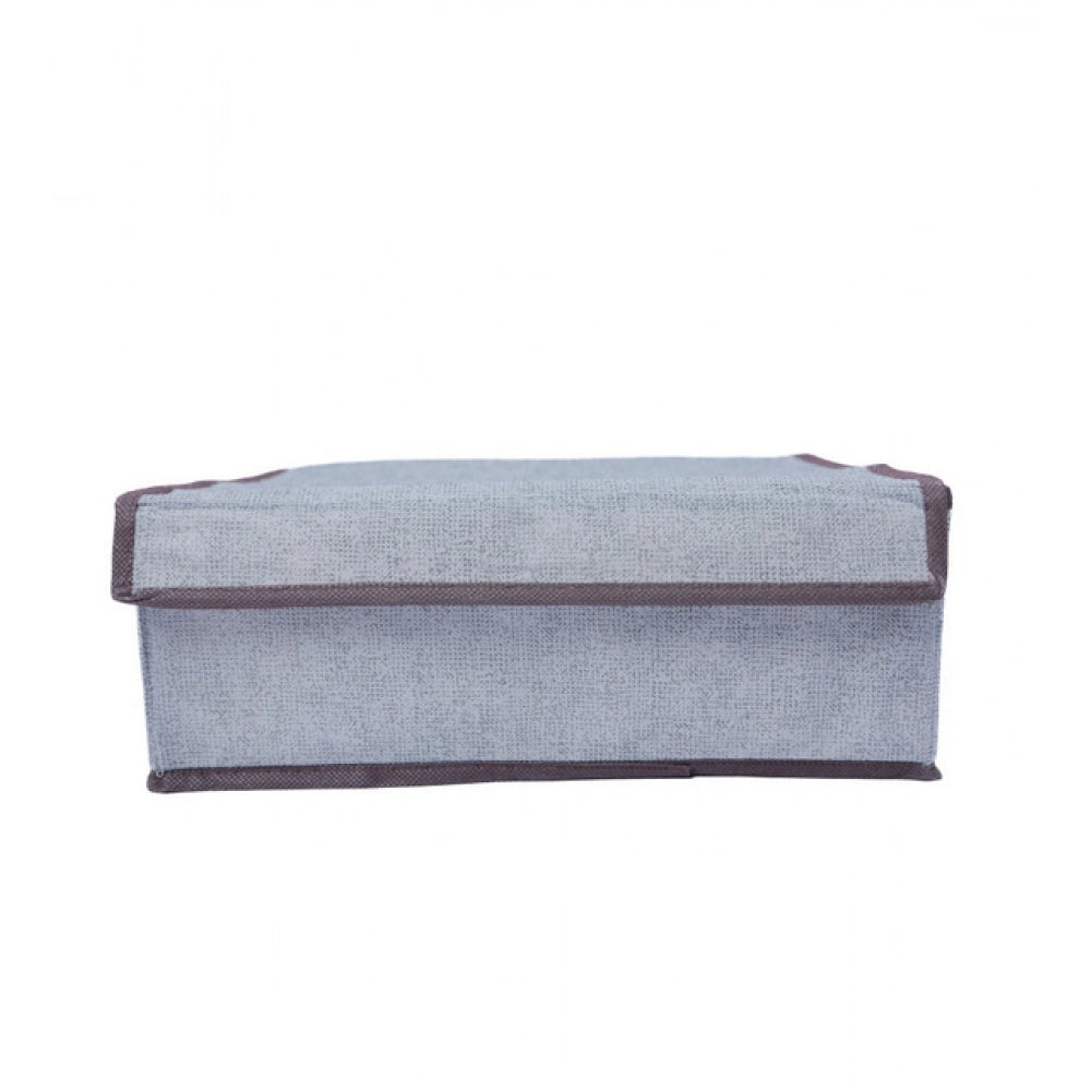 Multi-colored polypropylene storage box with three compartments for organized storage of clothes, accessories, toys, or household items