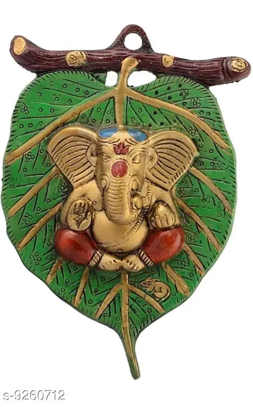 Metal Ganesh idol, Fashion Bizz religious icon, Indian Ganesha figure on leaf