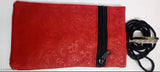 Red lace fabric pouch with adjustable strap, black handle