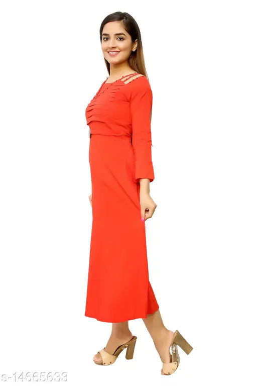 The image is of a woman wearing a red, mid-length dress. It features cap sleeves and appears to be made of a smooth fabric