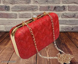 The image displays a red box clutch with a chain sling, fashionable and trendy accessory for bridesmaids, suitable for bridal party events or weddings