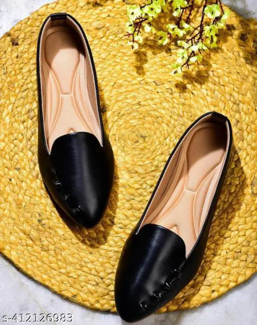 Black synthetic leather slip-on ballerinas for women, comfortable and stylish footwear on display