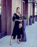 Black velvet outfit with embroidered sequin details and bell sleeve design
