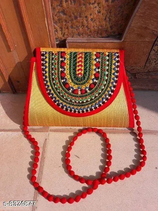 Trendy printed womens silk slingbag with bead detailing and large red tassel