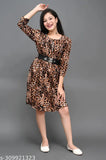 A young woman in a brown tiger print dress. The dress features short sleeves, a V-neckline and an elastic waistband. The background is neutral grey, emphasizing the dress