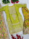 Green and gold Chinon party wear traditional embroidered suit with matching head wrap