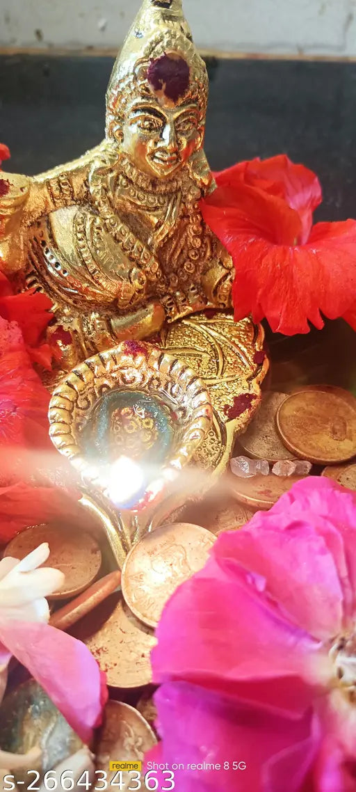 Divine gold idol of Shakti Kuber