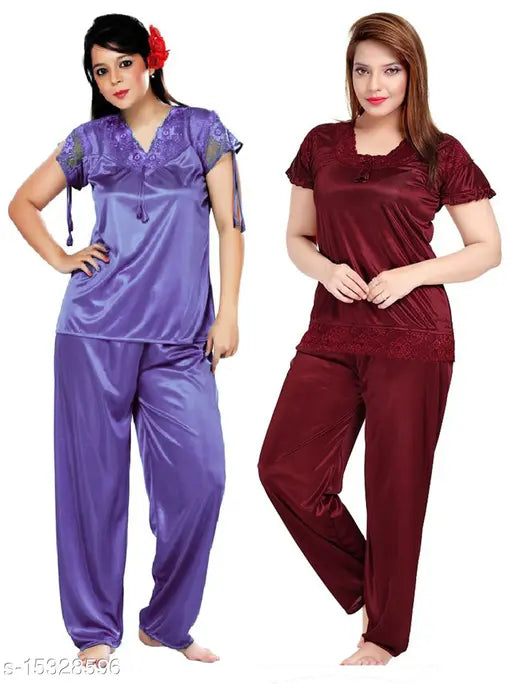 Trendy satin women's nightsuit combo (Free Size), solid pattern pyjama set with short sleeves on display rack