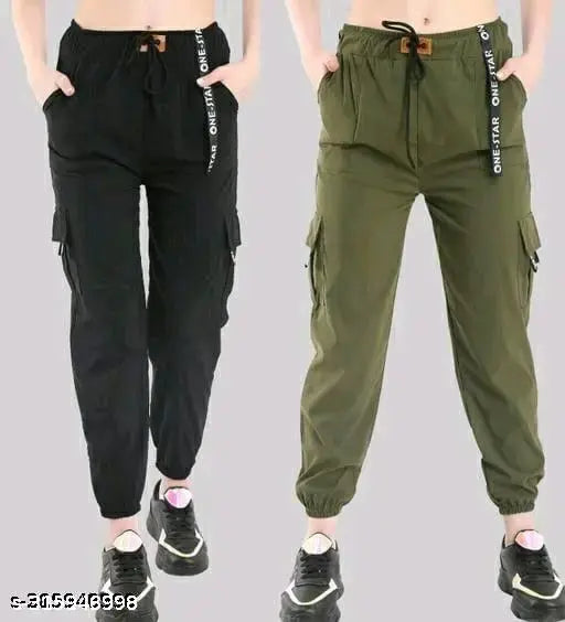 Two pairs of cargo pants, one dark, one olive green, with pockets and drawstrings, styled on a mannequin