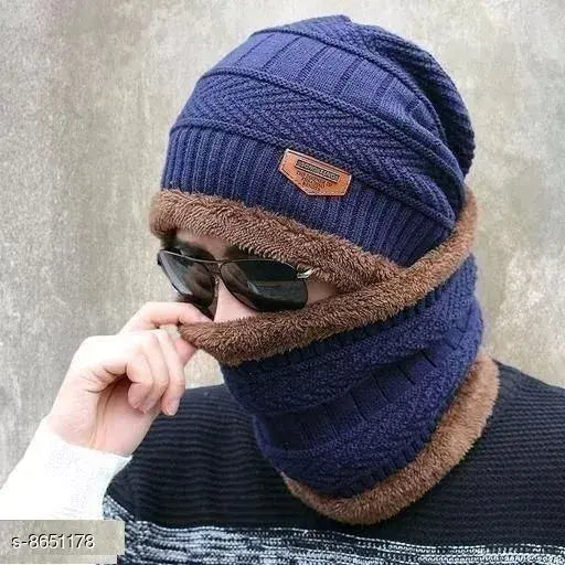 Black and brown knit hat with brand logo and sunnies