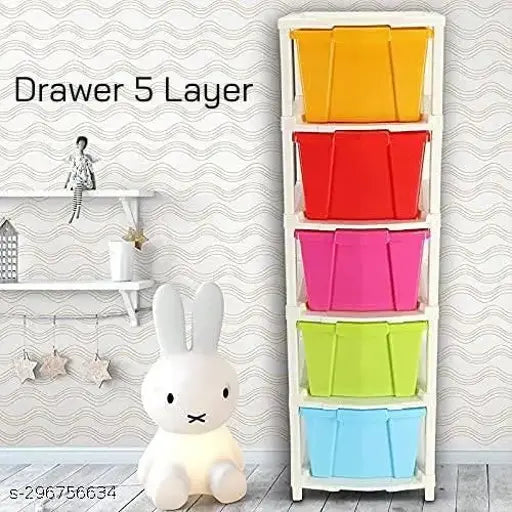 Multi-colored modular drawer system with 5 layers and a small toy on top
