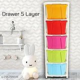 Multi-colored modular drawer system with 5 layers and a small toy on top