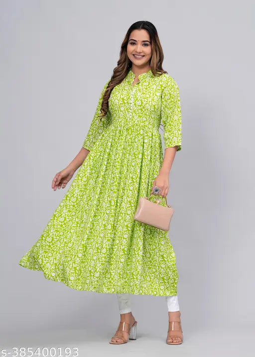 Green rayon printed Gaither Anarkali kurti set with pum-pom detail, three-quarter sleeves, includes short kurti and dupatta. Indian fashion for women's party wear