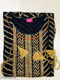 Anarkali kurta with intricate gold embroidery, featuring latkans and tassels on a traditional design