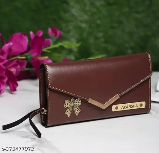 Brown leather clutch with name charm and zip closure