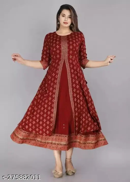 Red rayon printed long gown kurta with three-quarter sleeves and zari woven pattern, popular Indian fashion for women on mannequin