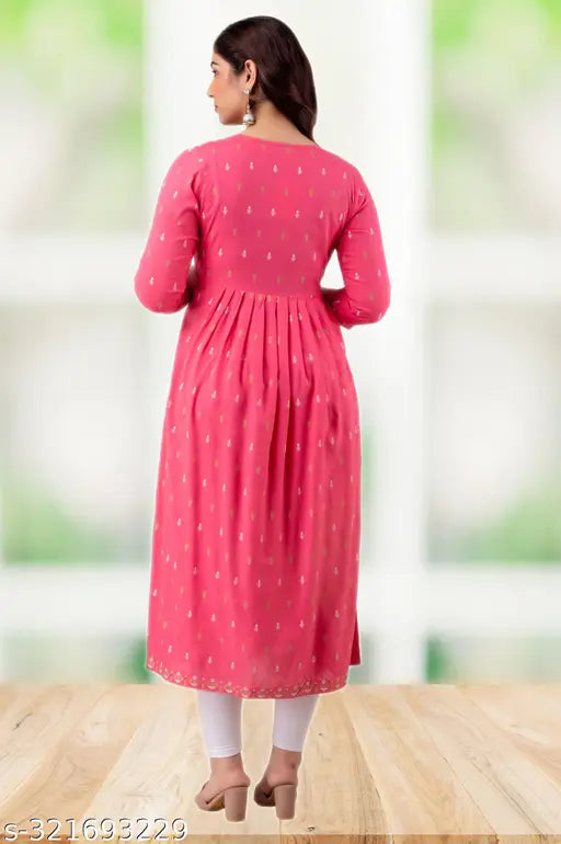 Pink rayon three-quarter sleeve VNYASHRI naira cut kurta with mirror work, featuring traditional shisha embroidery on neckline and block print. Elegant round neck design, calf-length, with two side slits. High-quality, breathable, soft fabric for all-day comfort. Made in India