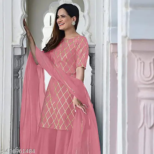 Pink dupatta with geometric embroidery on a woman's shoulder