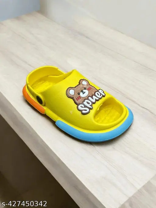 Yellow kids sandals with blue trim, cartoon character on top
