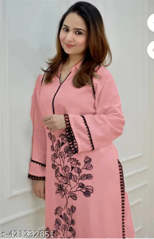 Black rayon kurta set with printed net pattern, long sleeves, and rayon bottomwear. Decorated with delicate lace detailings, thread embroidery, and Butta collar. Suitable for office, brunch outings, cards night, and airport look. Made in India