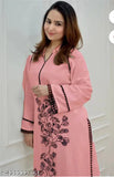 Black rayon kurta set with printed net pattern, long sleeves, and rayon bottomwear. Decorated with delicate lace detailings, thread embroidery, and Butta collar. Suitable for office, brunch outings, cards night, and airport look. Made in India